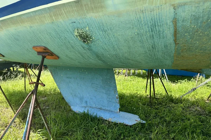 Slide: The Image of Bottom view of 1999 Beneteau Oceanis 400 sailboat on stands, showing keel and hull condition. - 32