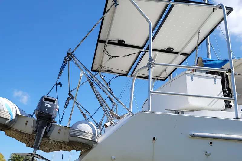 Slide: The Image of Beneteau Oceanis 40CC 1999 sailboat with solar panels and outboard motor, under clear blue sky. - 33