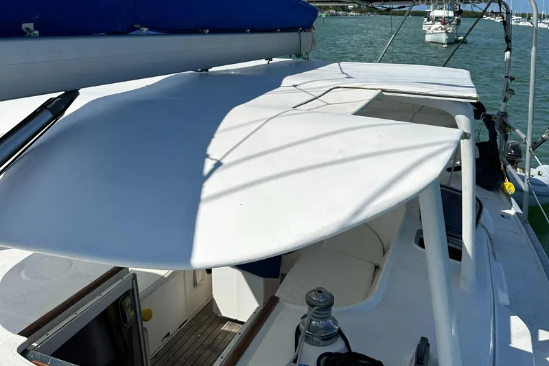 Slide: The Image of 1999 Beneteau Oceanis 40CC sailboat deck with cockpit view, moored in a marina. - 36