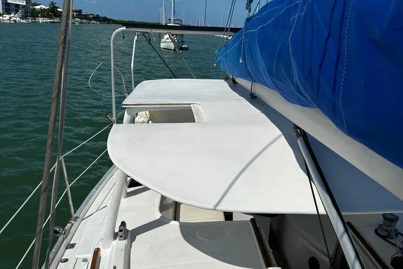 Slide: The Image of Sailboat deck view of 1999 Beneteau Oceanis 40CC with blue sail cover. - 37