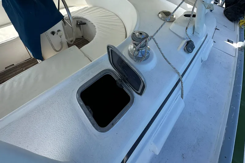Slide: The Image of Beneteau Oceanis 40CC 1999 yacht deck with open hatch and winch. - 39