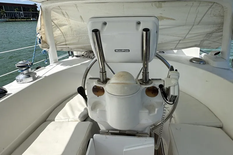 Slide: The Image of Cockpit of 1999 Beneteau Oceanis 40CC sailboat with steering wheel and navigation equipment. - 41