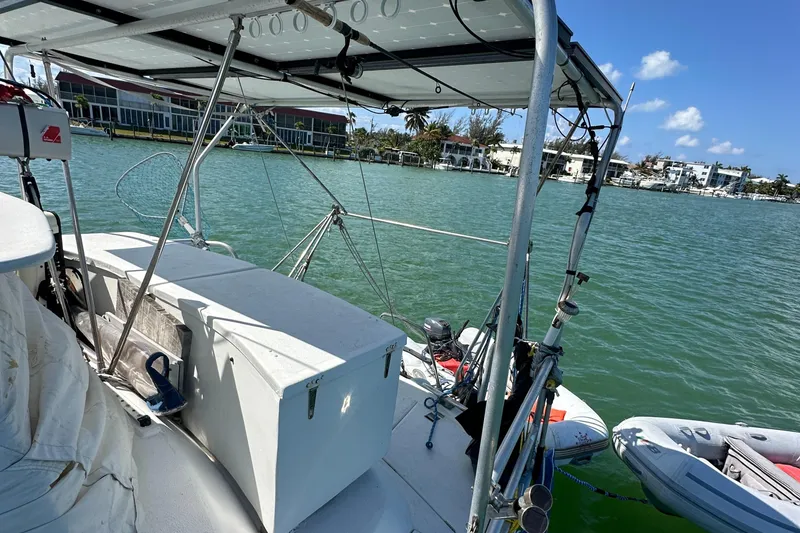Slide: The Image of Beneteau Oceanis 40CC sailboat deck, 1999 model, docked on a sunny day with calm waters. - 43