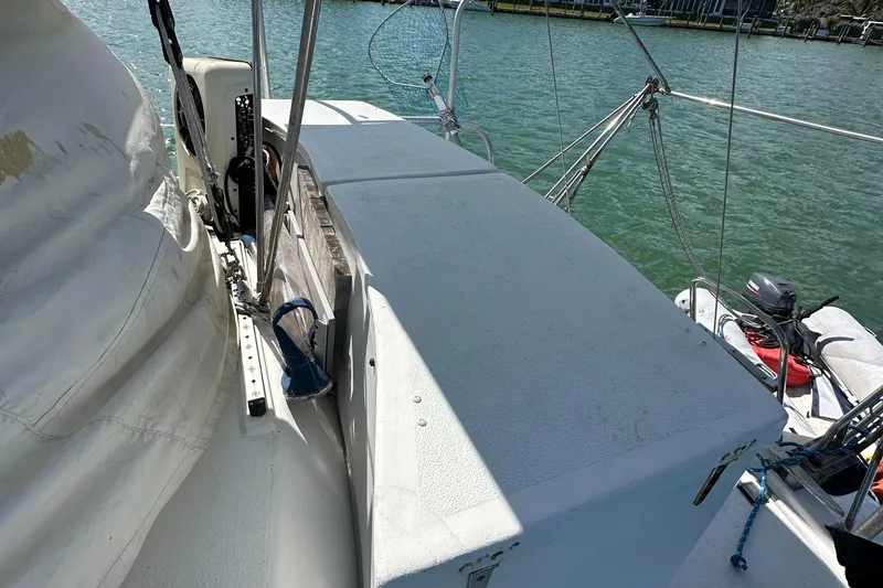 Slide: The Image of 1999 Beneteau Oceanis 40CC sailboat deck with equipment, docked by the water. - 44