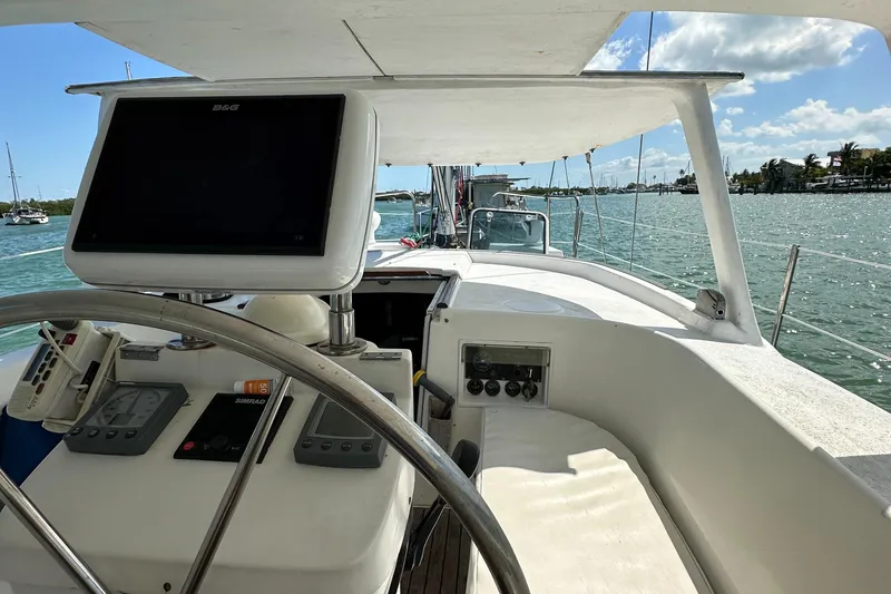 Slide: The Image of Cockpit view of 1999 Beneteau Oceanis 40CC sailboat with navigation equipment and steering wheel. - 5