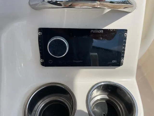 Slide: The Image of Fusion stereo system and cup holders on 2022 Grady-White Fisherman 216 boat. - 13