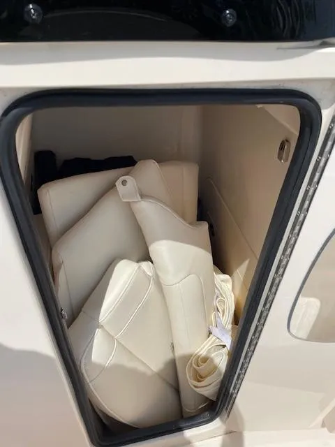 Slide: The Image of Storage compartment with cushions on a 2022 Grady-White Fisherman 216 boat. - 17