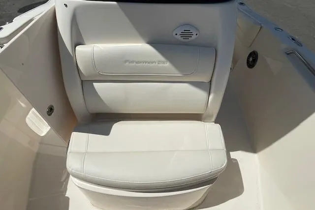 Slide: The Image of 2022 Grady-White Fisherman 216 boat seat with white upholstery and integrated speaker. - 25