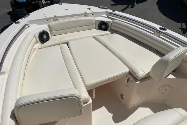 Slide: The Image of 2022 Grady-White Fisherman 216 boat interior with cushioned seating and speakers. - 26