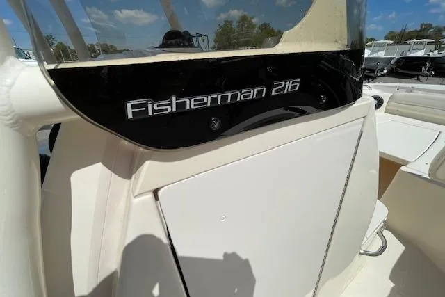 Slide: The Image of 2022 Grady-White Fisherman 216 boat console with clear sky reflection. - 29
