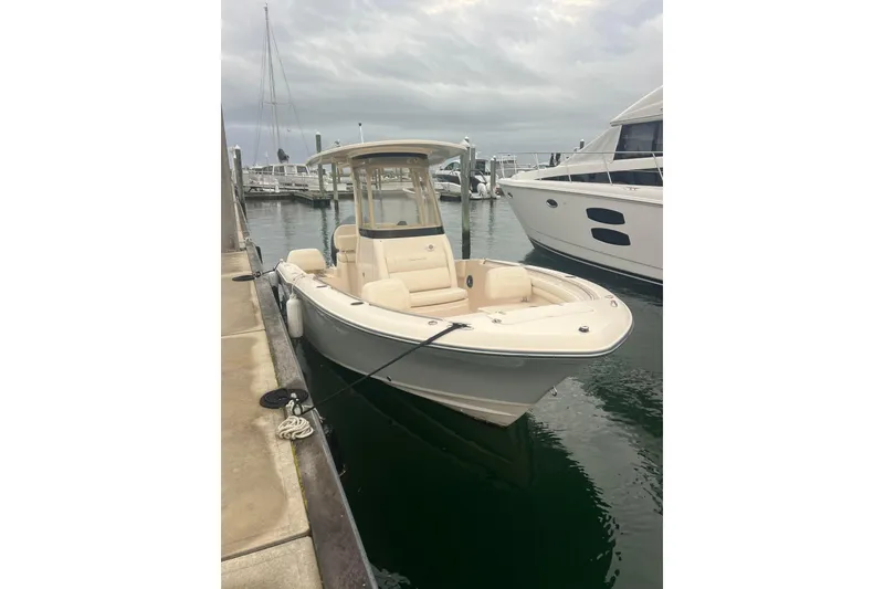 Slide: The Image of 2022 Grady-White Fisherman 216 boat docked at marina under cloudy sky. - 30
