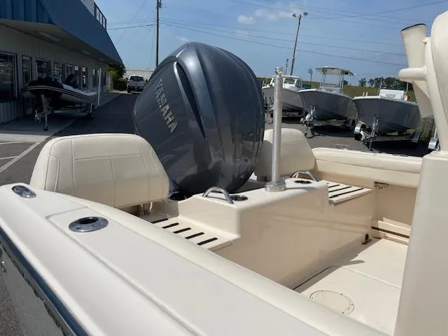 Slide: The Image of 2022 Grady-White Fisherman 216 boat with Yamaha engine, displayed at a dealership. - 7