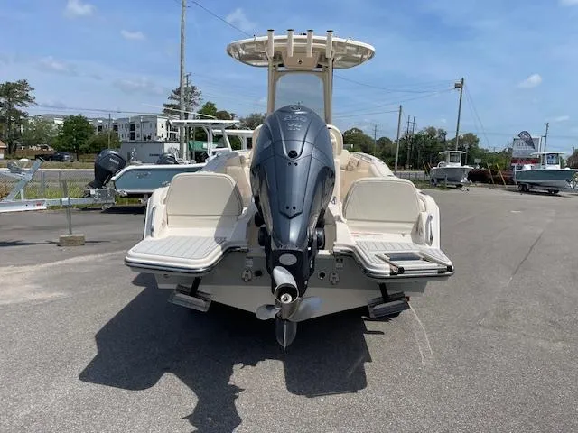 Slide: The Image of 2022 Grady-White Fisherman 216 boat, rear view with outboard motor, parked on asphalt. - 9