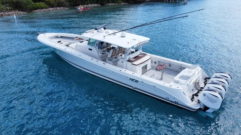 Slide: The Image of 2018 HCB 53 Sueños boat cruising on clear blue water. - 10