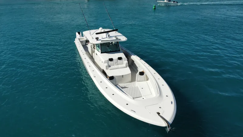 Slide: The Image of 2018 HCB 53 Sueños boat on clear blue water, aerial view. - 12