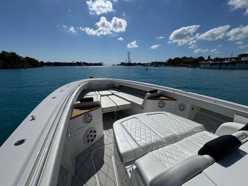 Slide: The Image of 2018 HCB 53 Sueños boat with luxurious seating on a sunny day at sea. - 17