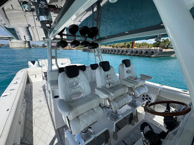 Slide: The Image of Luxurious 2018 HCB 53 Sueños boat interior with plush seating and ocean view. - 20
