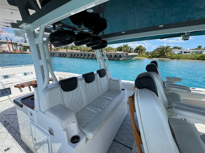 Slide: The Image of Luxurious 2018 HCB 53 Sueños boat interior with white seating and ocean view. - 21