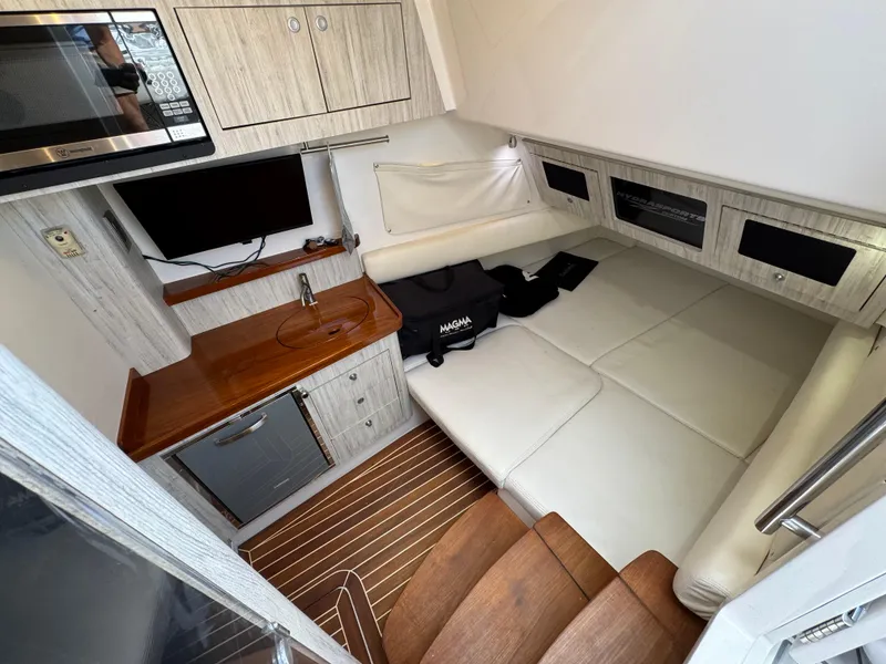 Slide: The Image of Interior of 2018 HCB 53 Sueños boat with kitchenette and seating area. - 26