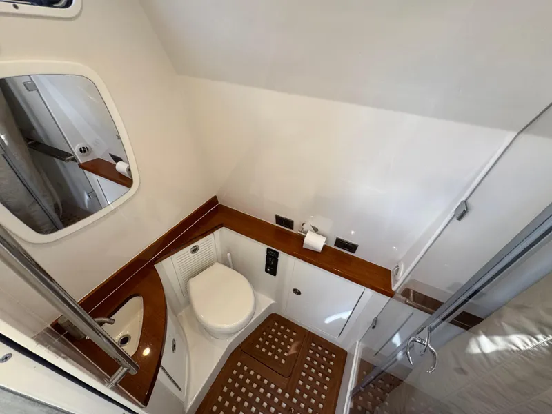 Slide: The Image of Luxurious 2018 HCB 53 Sueños yacht bathroom with modern fixtures and wooden accents. - 28