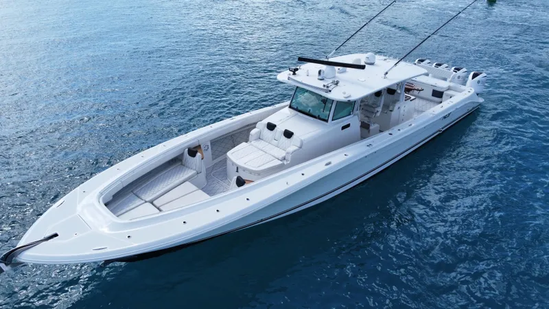 Slide: The Image of 2018 HCB 53 Sueños luxury boat on calm blue water. - 3