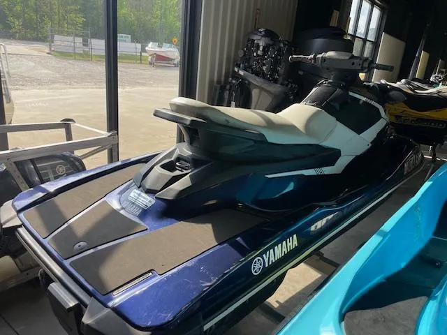 Slide: The Image of 2018 Yamaha WaveRunner EX Sport jet ski in showroom, blue and white design. - 5