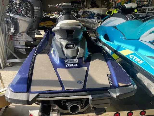 Slide: The Image of 2018 Yamaha WaveRunner EX Sport in storage, rear view, blue and gray color scheme. - 6