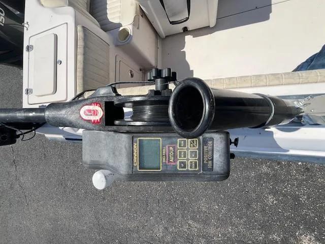 Slide: The Image of Close-up of a 2005 Grady-White 232 Gulfstream boat's control panel and seating area. - 12