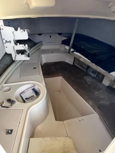 Slide: The Image of 2005 Grady-White 232 Gulfstream cabin interior with storage and seating areas. - 15