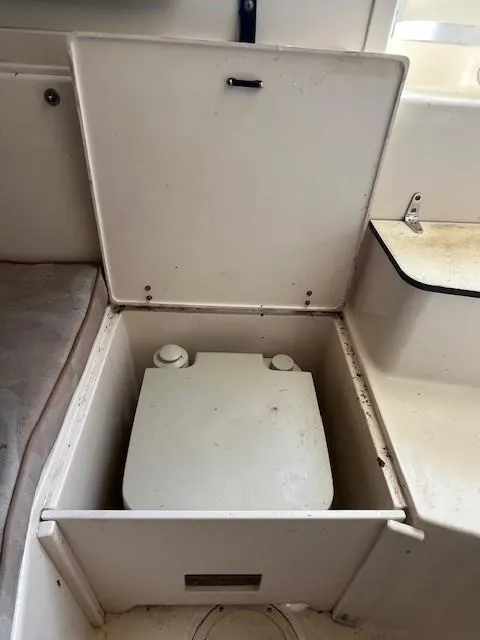 Slide: The Image of 2005 Grady-White 232 Gulfstream boat storage compartment with lid open. - 17