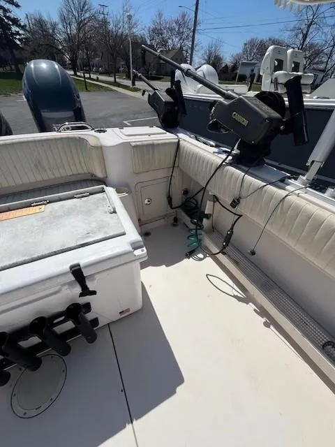 Slide: The Image of 2005 Grady-White 232 Gulfstream boat interior with fishing equipment and seating. - 6