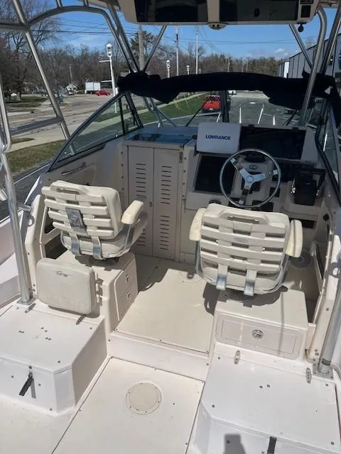 Slide: The Image of 2005 Grady-White 232 Gulfstream boat interior with dual seats and steering console. - 7