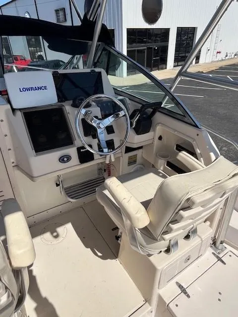 Slide: The Image of 2005 Grady-White 232 Gulfstream boat cockpit with Lowrance navigation system. - 9