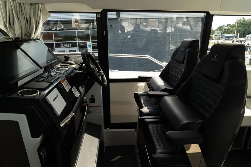 Slide: The Image of Interior of 2025 Wellcraft 38 Explorer boat with modern helm and seating. - 20