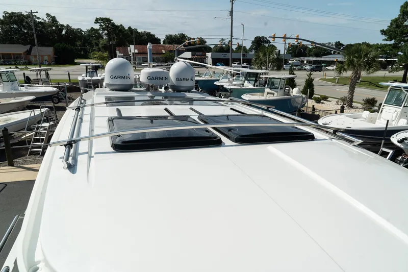 Slide: The Image of 2025 Wellcraft 38 Explorer boat with Garmin equipment, docked in a marina. - 39