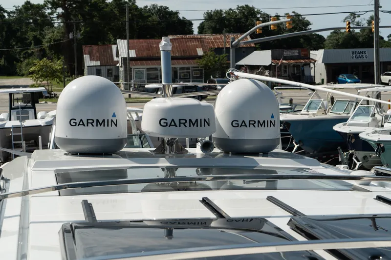 Slide: The Image of 2025 Wellcraft 38 Explorer with Garmin equipment on deck, docked in a marina. - 40