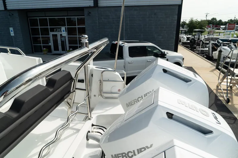 Slide: The Image of 2025 Wellcraft 38 Explorer with dual Mercury engines, parked outside a dealership. - 6