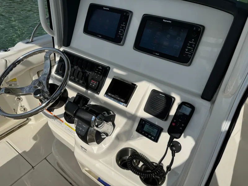 Slide: The Image of Control panel of a 2015 Boston Whaler 250 Outrage boat with navigation equipment. - 14