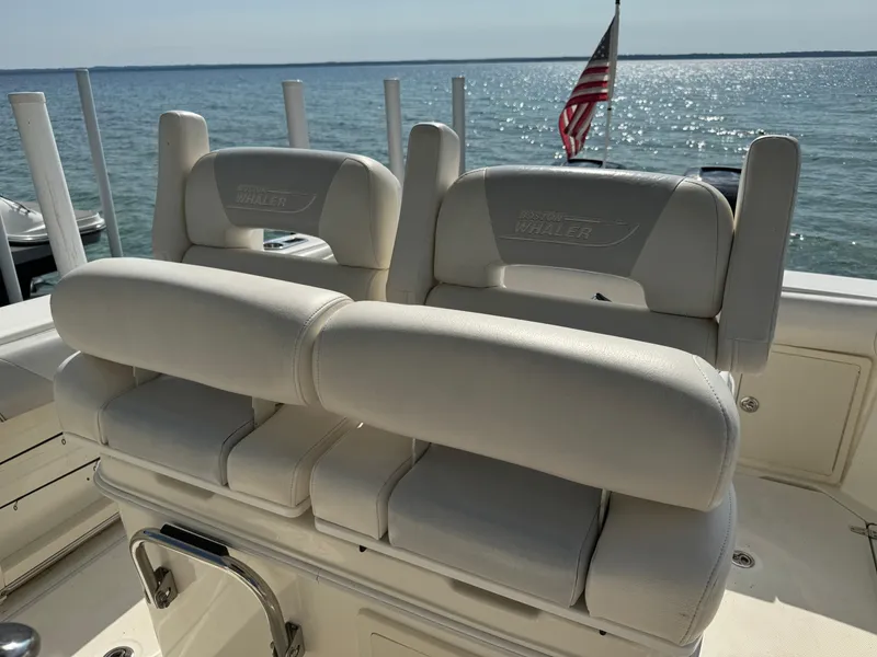 Slide: The Image of Boston Whaler 250 Outrage 2015 boat seats with ocean view and American flag. - 21