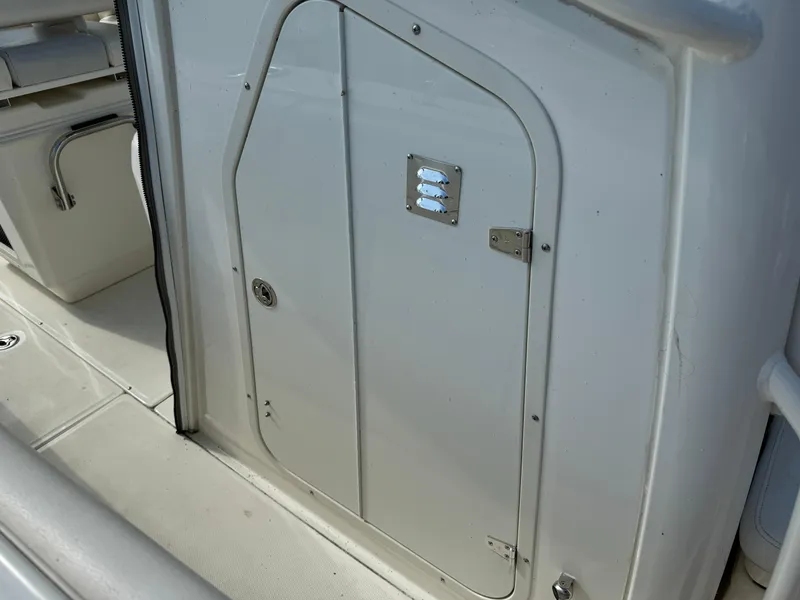 Slide: The Image of 2015 Boston Whaler 250 Outrage boat interior door detail. - 29