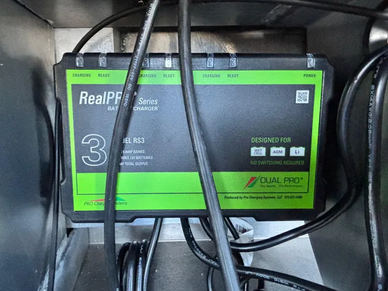 Slide: The Image of Battery charger in a 2025 Ranger RT188 boat, featuring Dual Pro RealPro Series. - 11