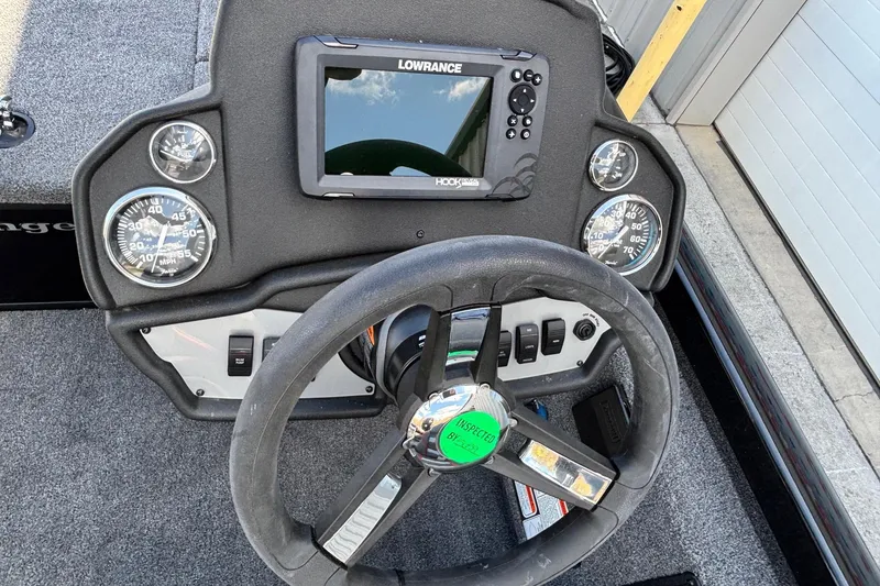 Slide: The Image of Steering console of 2025 Ranger RT188 boat with Lowrance fishfinder and gauges. - 13
