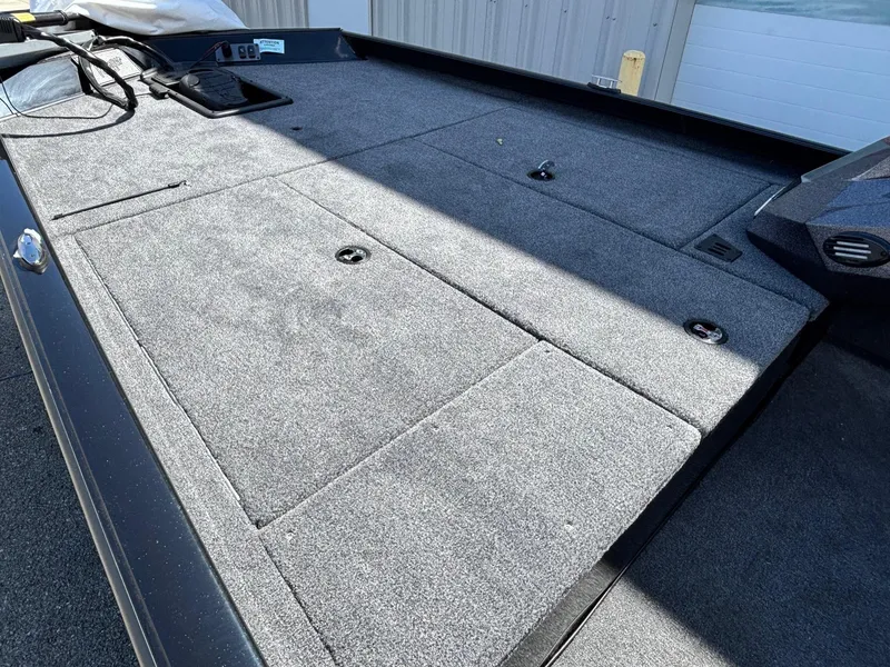 Slide: The Image of 2025 Ranger RT188 boat deck with storage compartments, featuring a sleek, carpeted surface. - 4