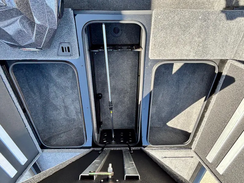 Slide: The Image of 2025 Ranger RT188 boat storage compartments with open hatches, showcasing spacious interior design. - 6