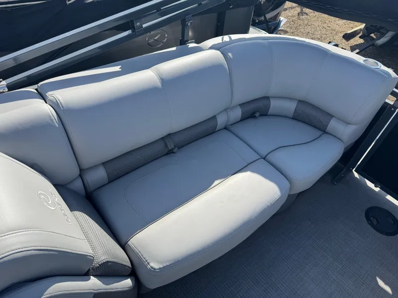 Slide: The Image of 2020 Regency 230 LE3 boat steering wheel and dashboard controls. - 10