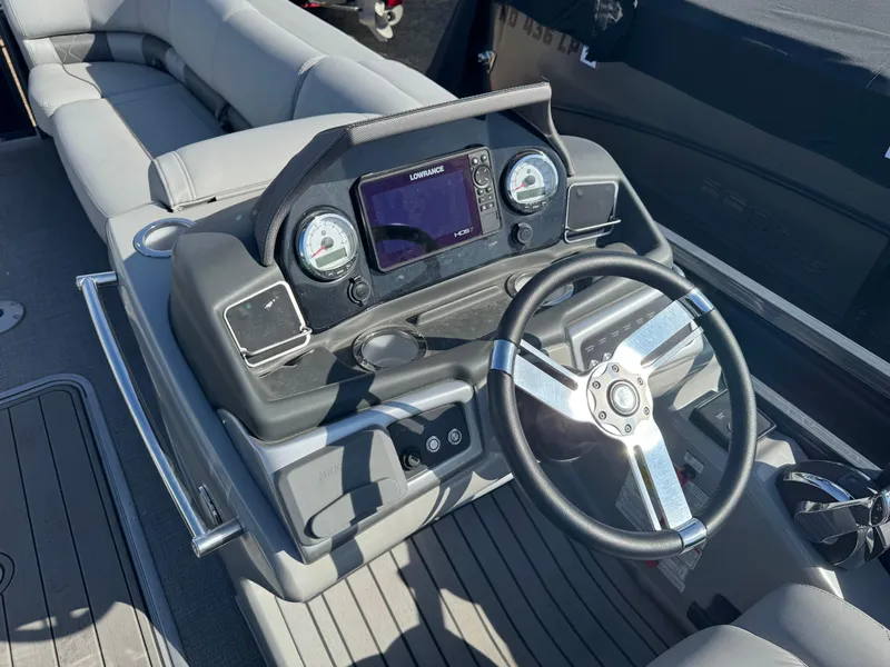 Slide: The Image of Luxurious seating on 2020 Regency 230 LE3 boat with cup holder and storage compartment. - 14