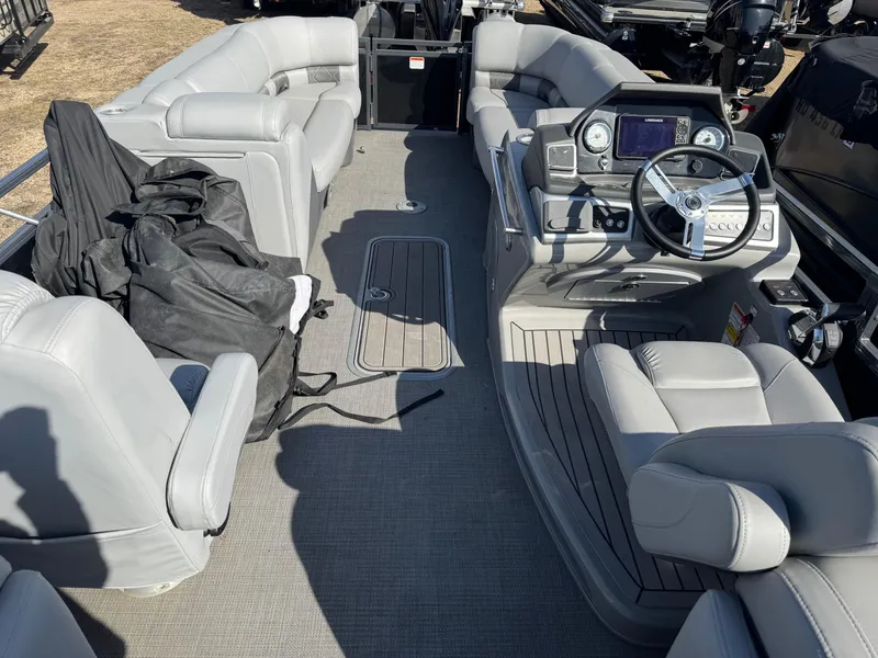 Slide: The Image of 2020 Regency 230 LE3 boat seat with armrests and cup holders. - 6