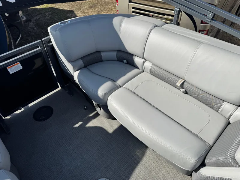 Slide: The Image of 2020 Regency 230 LE3 boat dashboard with steering wheel and gauges. - 8