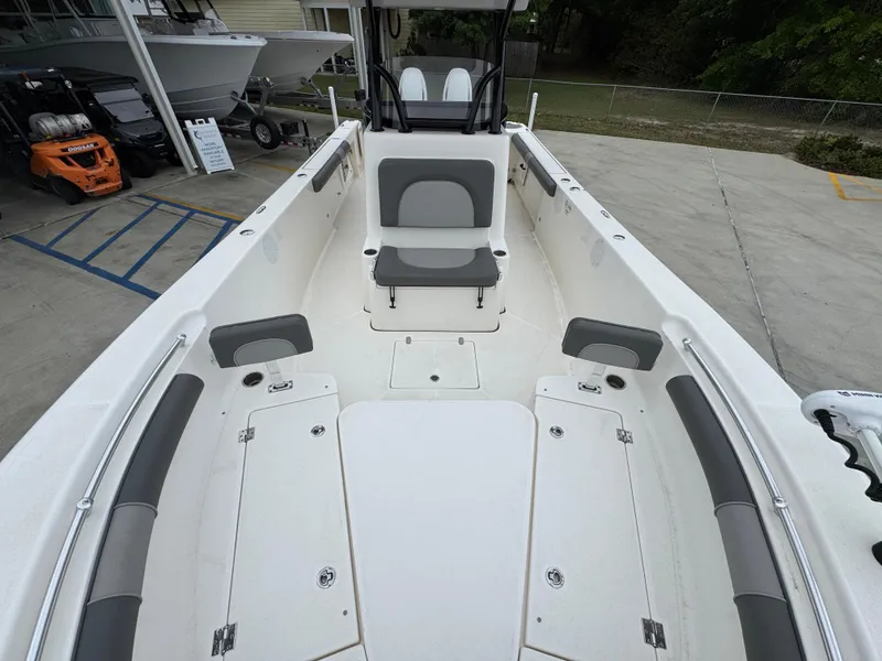 Slide: The Image of 2023 Sea Born LX26 Center Console boat interior with seating and storage compartments. - 21