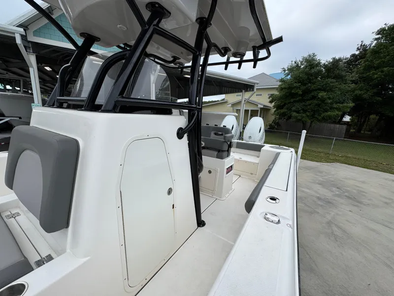 Slide: The Image of 2023 Sea Born LX26 Center Console boat, featuring sleek design and spacious deck. - 23